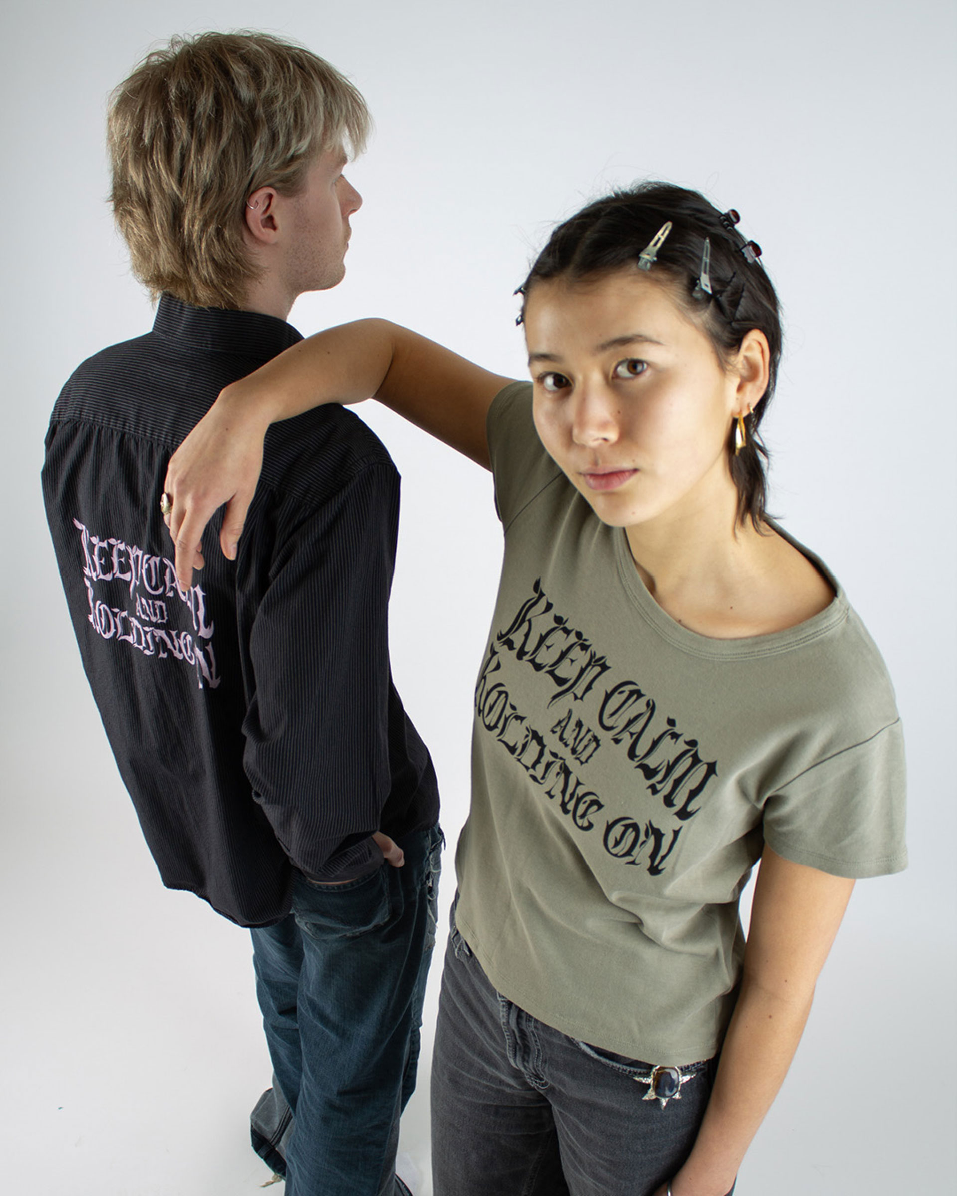 Two people wearing a t-shirt and a shirt with the same print.