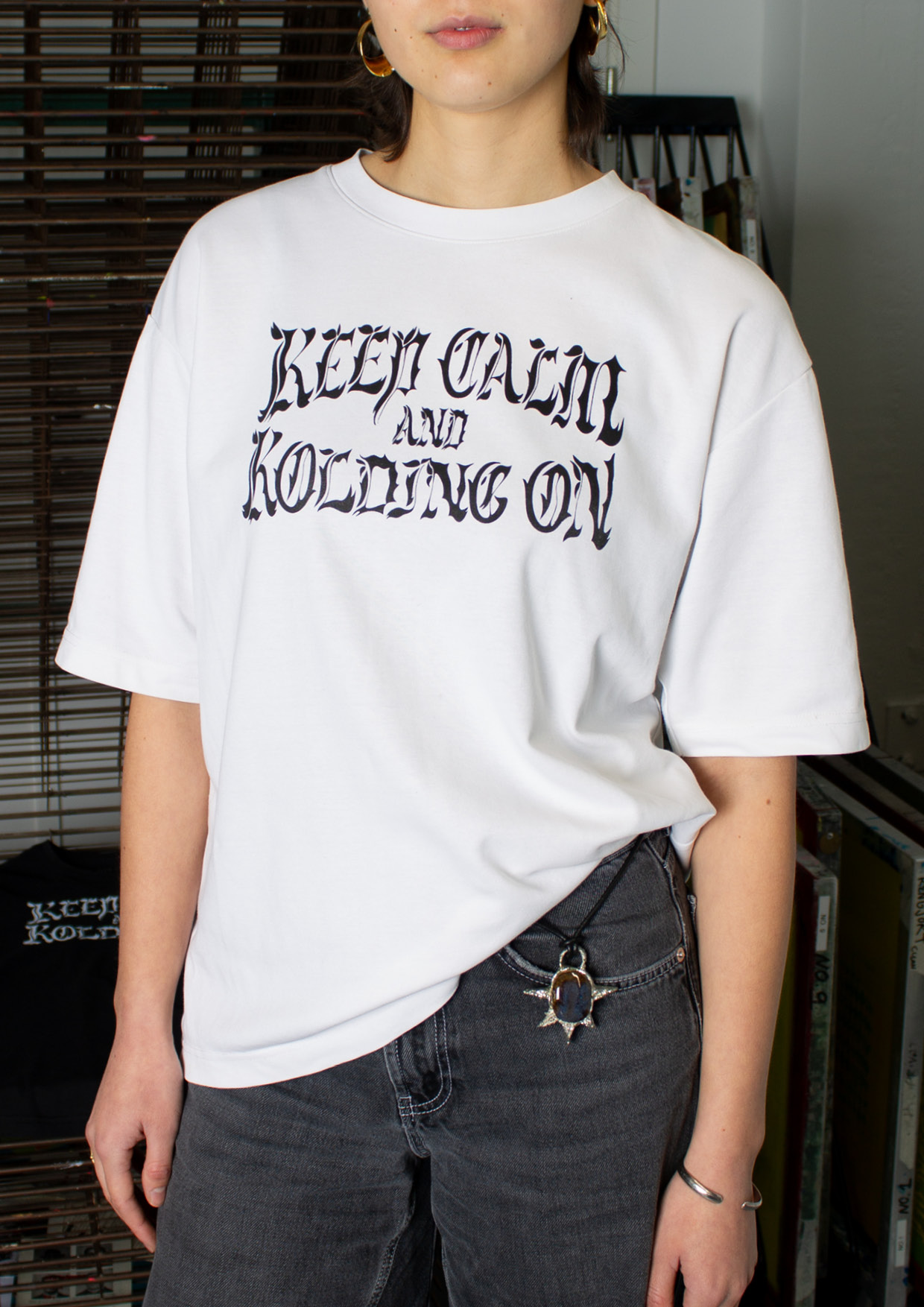 A t-shirt with the illustrative typography that says keep calm and kolding on.